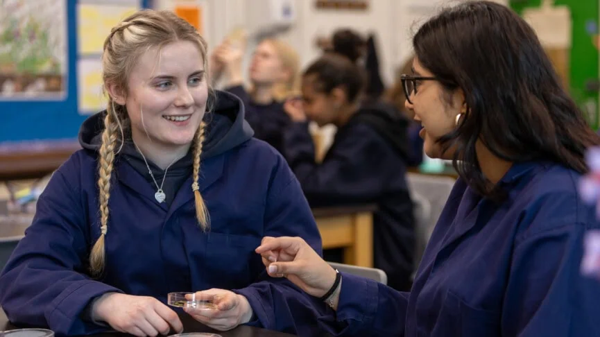 Biology students chatting in the lab
