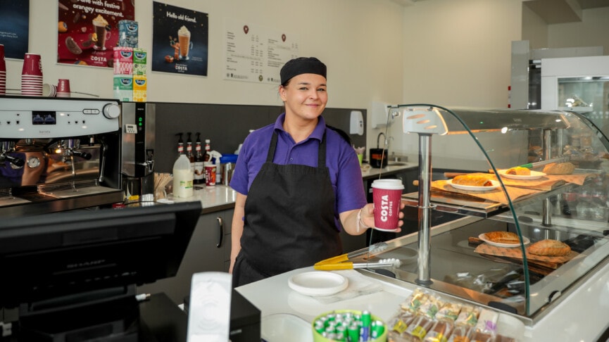 Break Time Image Of Costa Coffee Barrista Holding A Cup