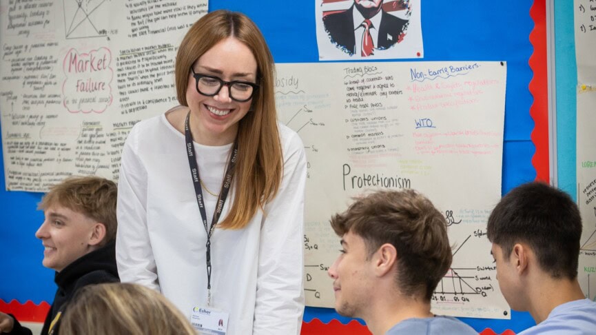Melissa teaching in an economics classroom