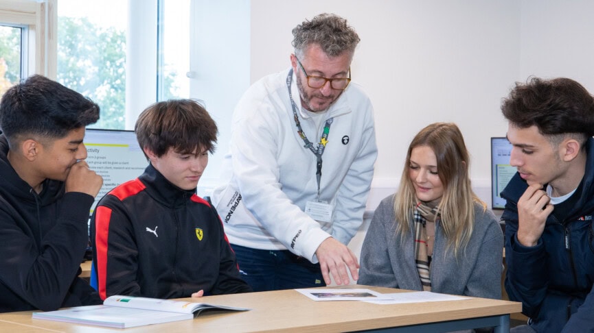 Glenn helping students in computer room