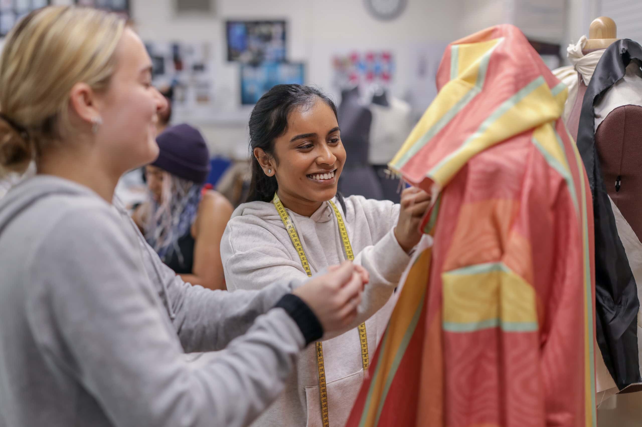 girls working in fashion and textiles class
