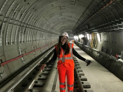 Systems engineer for transport for London standing in tunnel