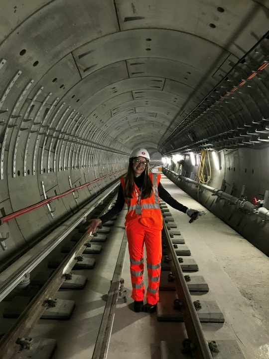 Systems engineer for transport for London standing in tunnel