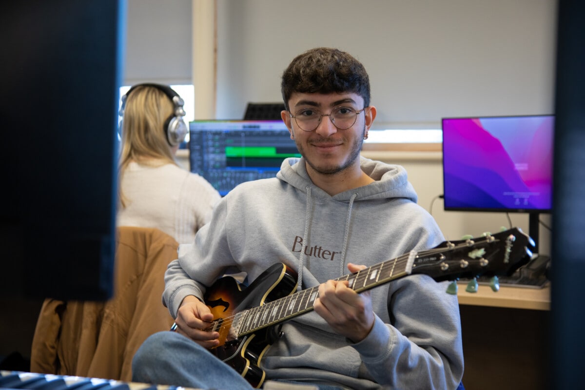 Boy holding a guitar