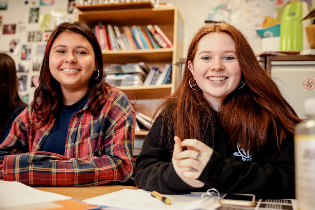 2 girls smiling in Politics class