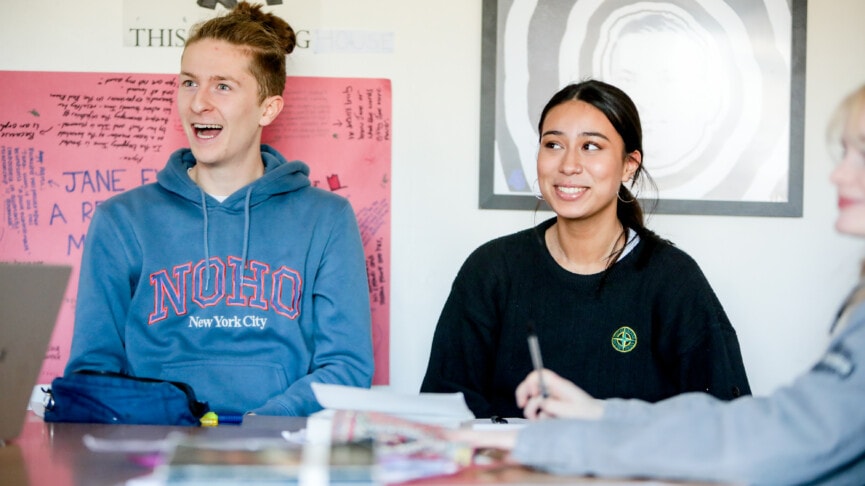 Two English Students Looking Surprised In A Class Debate