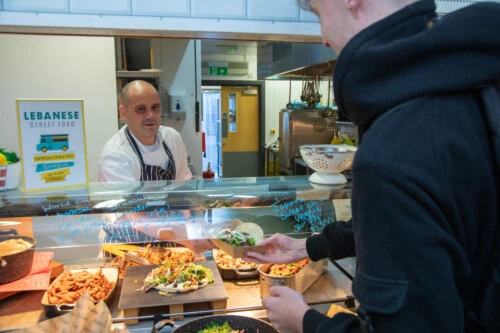 Student buying lunch in cafe