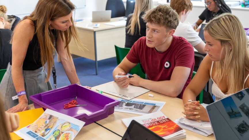 Sociology teacher and students engaging in class