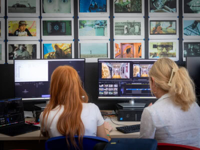 Two female students using editing software