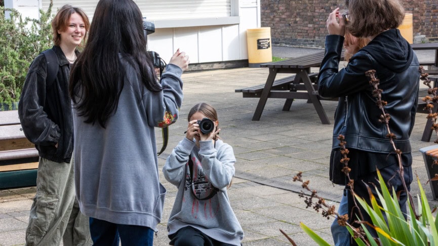 Photography students using cameras