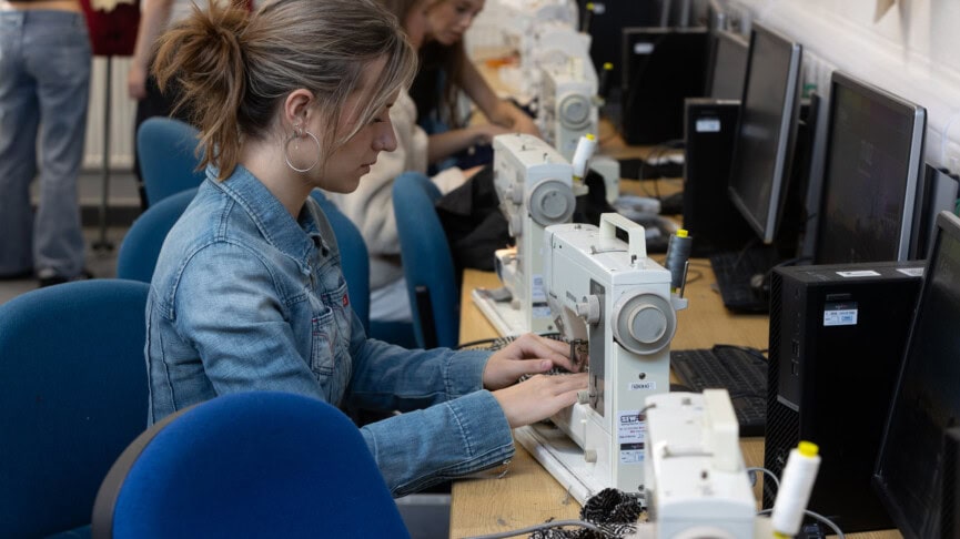 fashion student using a sewing machine