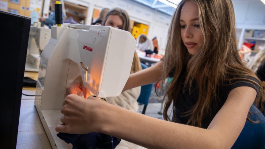 fashion student using a sewing machine
