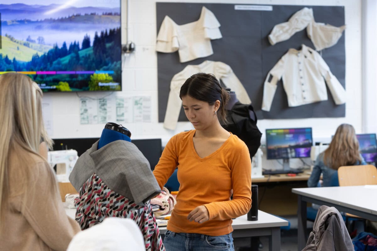 fashion student working at a mannequin