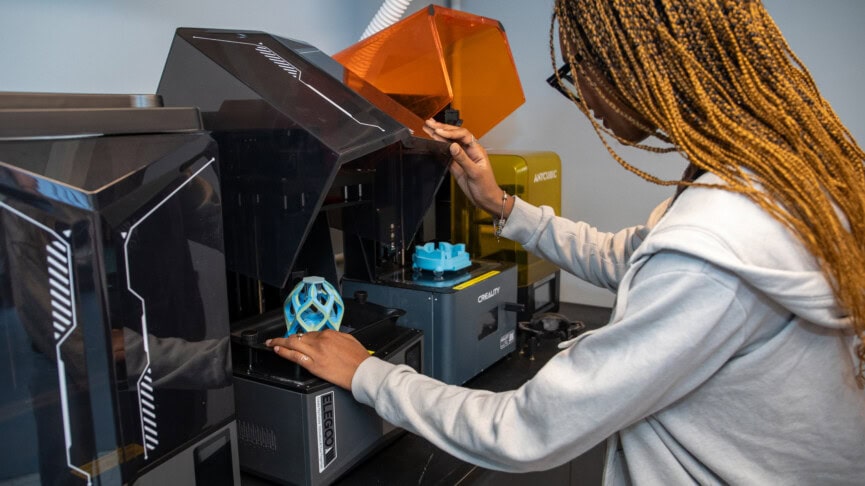 a female student using a 3d printer