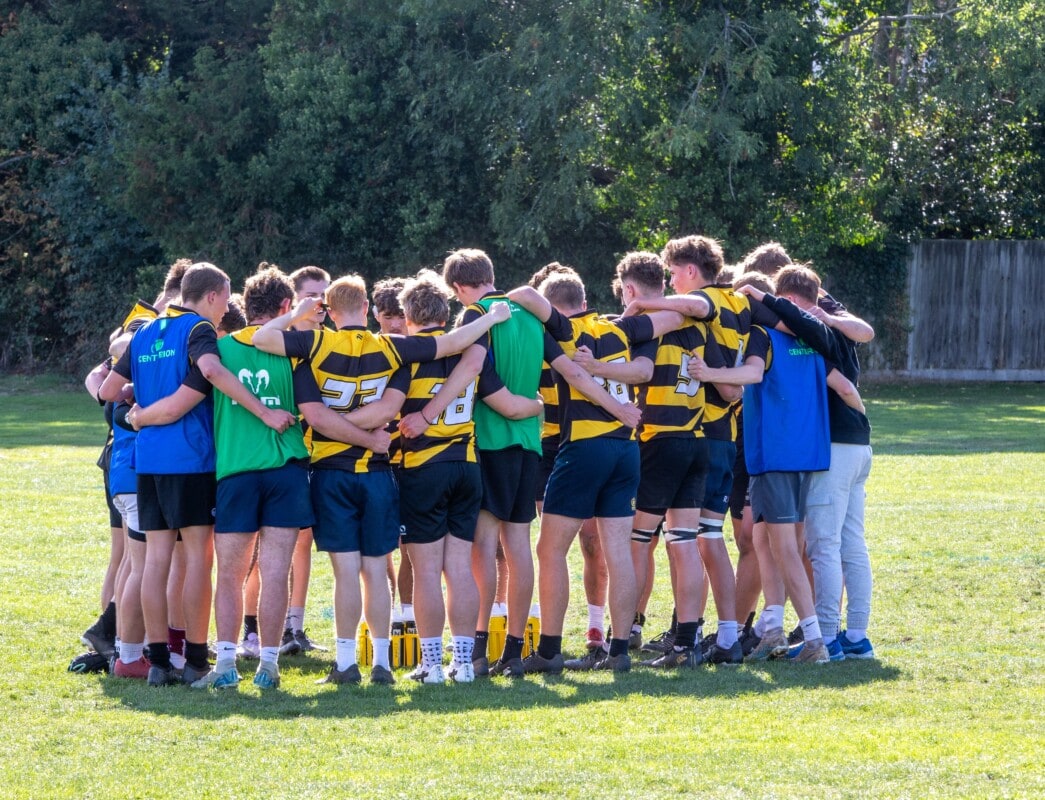 Rugby players in a huddle