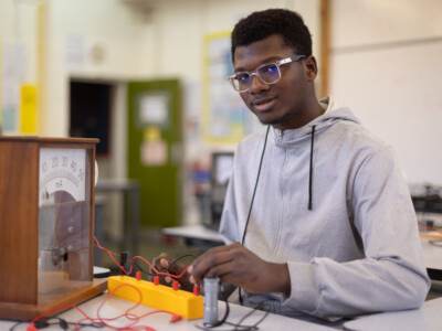Physics student working with some wires