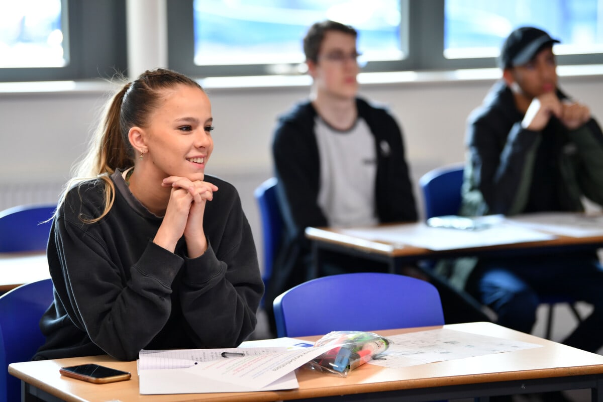 Girl sitting at desk in psychology lesson