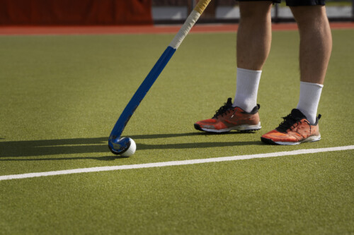 Hockey player on grass