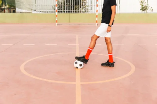 Indoor Football Player With Ball
