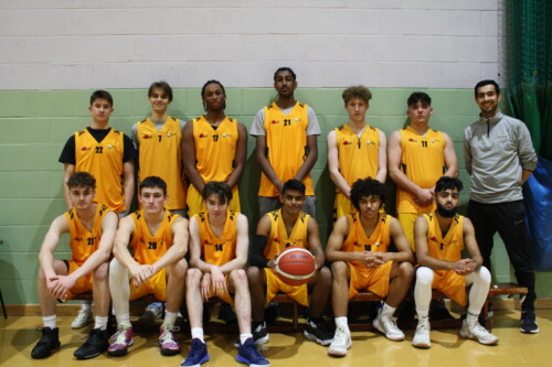 Mens Basketball Team With Coach