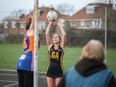 GA shooting ball at netball hoop