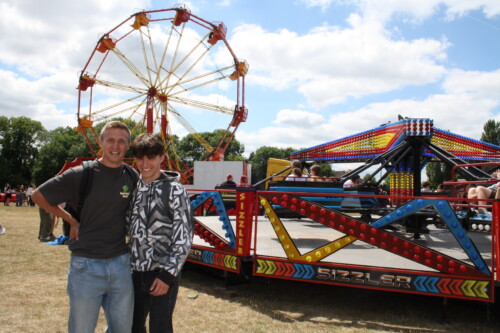 Boys In Front Of Rides