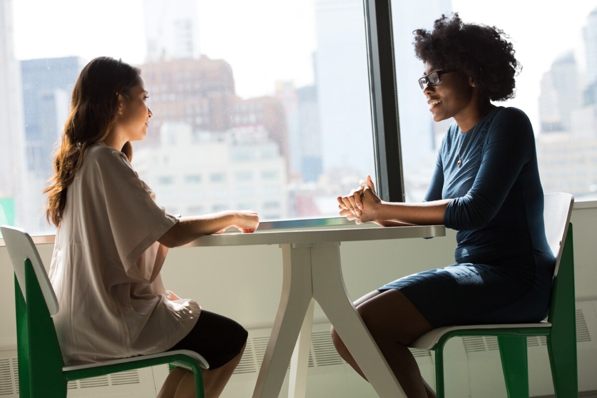 Photo of two people talking