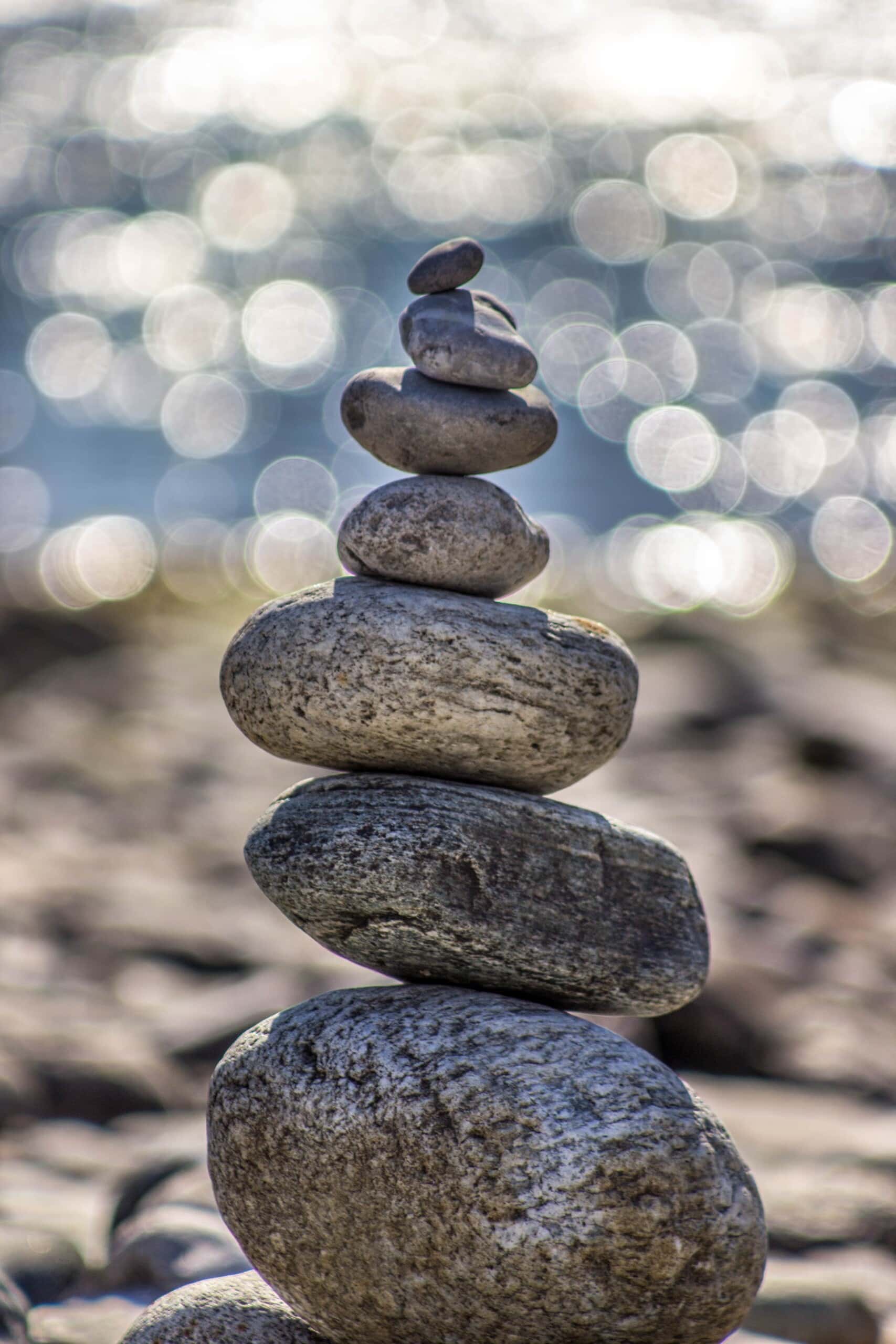 Pebbles on a beach balancing on one another