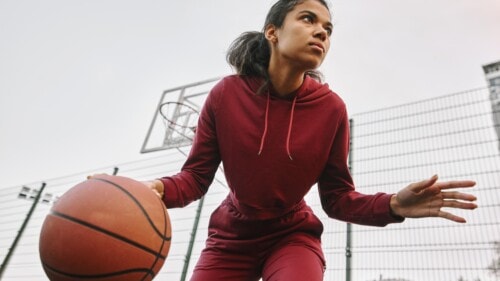 Low Angle Woman Playing Basketball