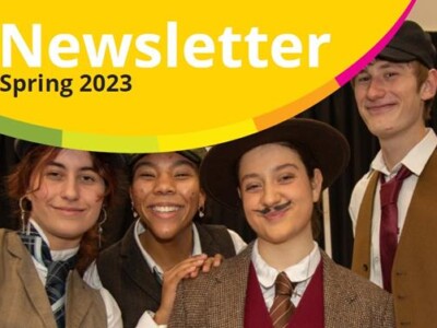 Front cover of the College Newsletter with a photo of four drama students in costume smiling