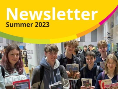 cover of the summer newsletter 2023 showing a group of students holding up university prospectuses