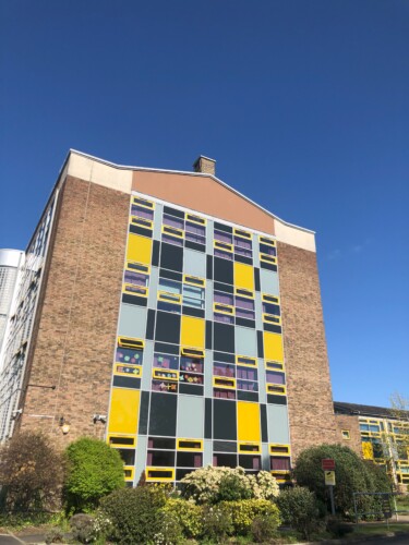 the tower block with blue skies