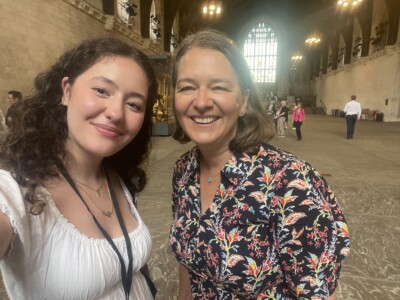 a student takes a selfie with an MP in the westminster hall