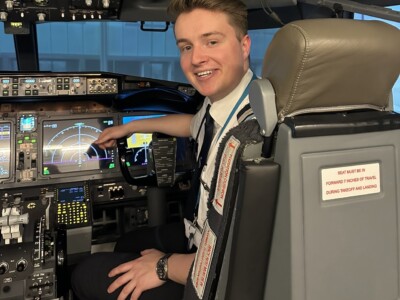 Alumni Josh Black Pilot sitting in a cockpit