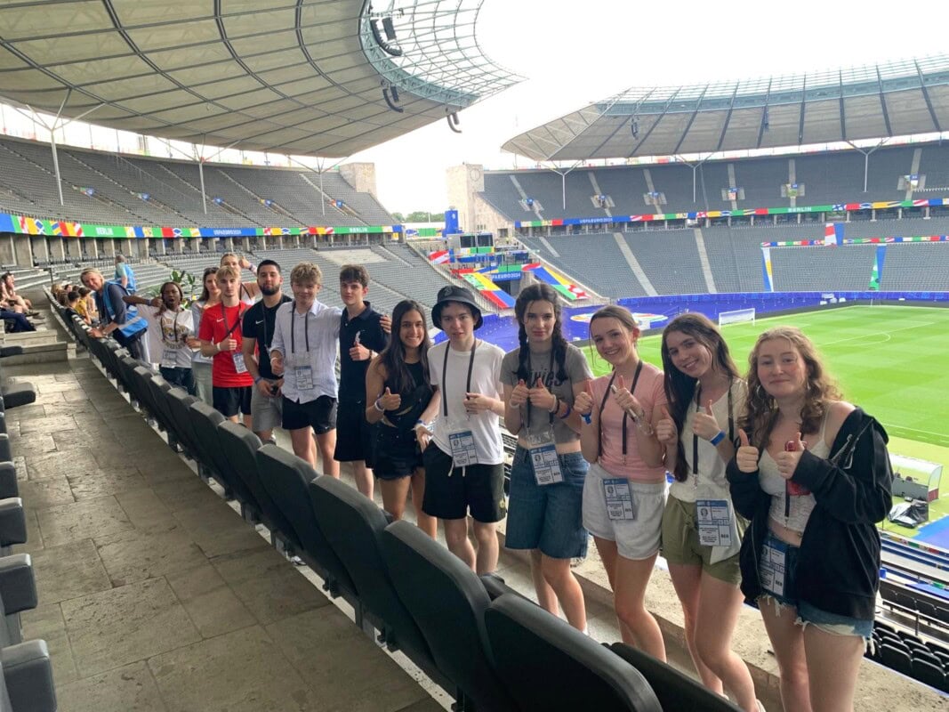 Students in the stands at a football Stadium in Berlin