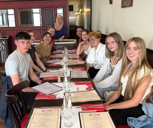 Group of students In a french Restaurant