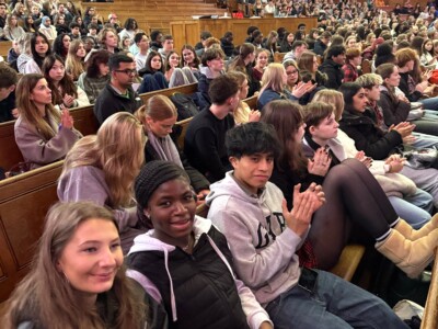 Packed student audience at conference auditorium