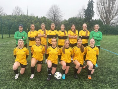 Women's Football Team in yellow Esher kit