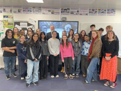 group of students standing at the front of the classroom with Dillon Wood