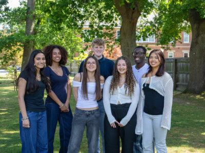 Student union group of 6 group of standing under the trees smiling