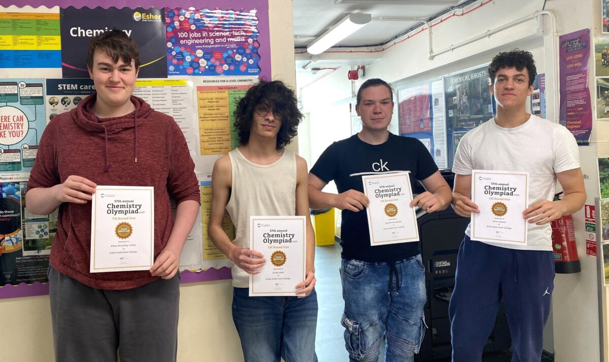 4 male students holding up certificates