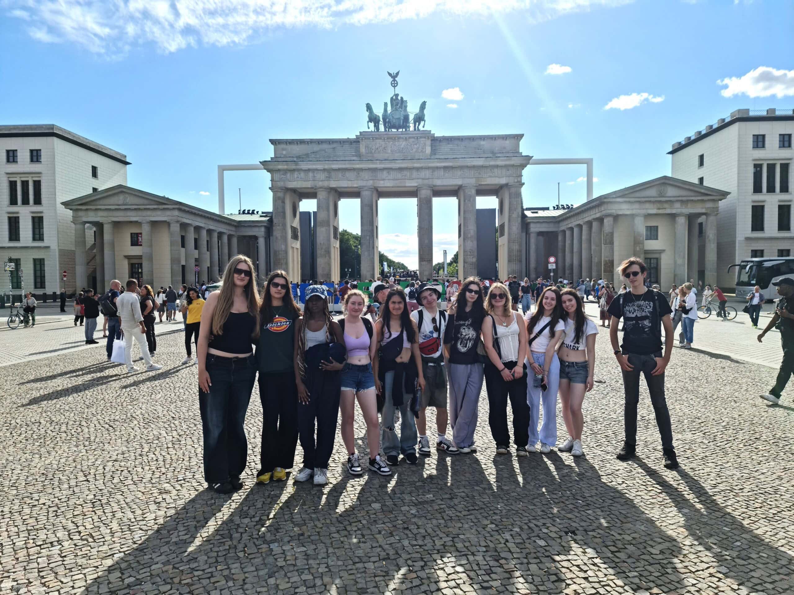 students standing in front of the Brandenburg Gate