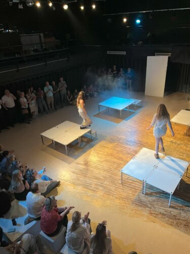 Model showing off design at Esher annual catwalk show