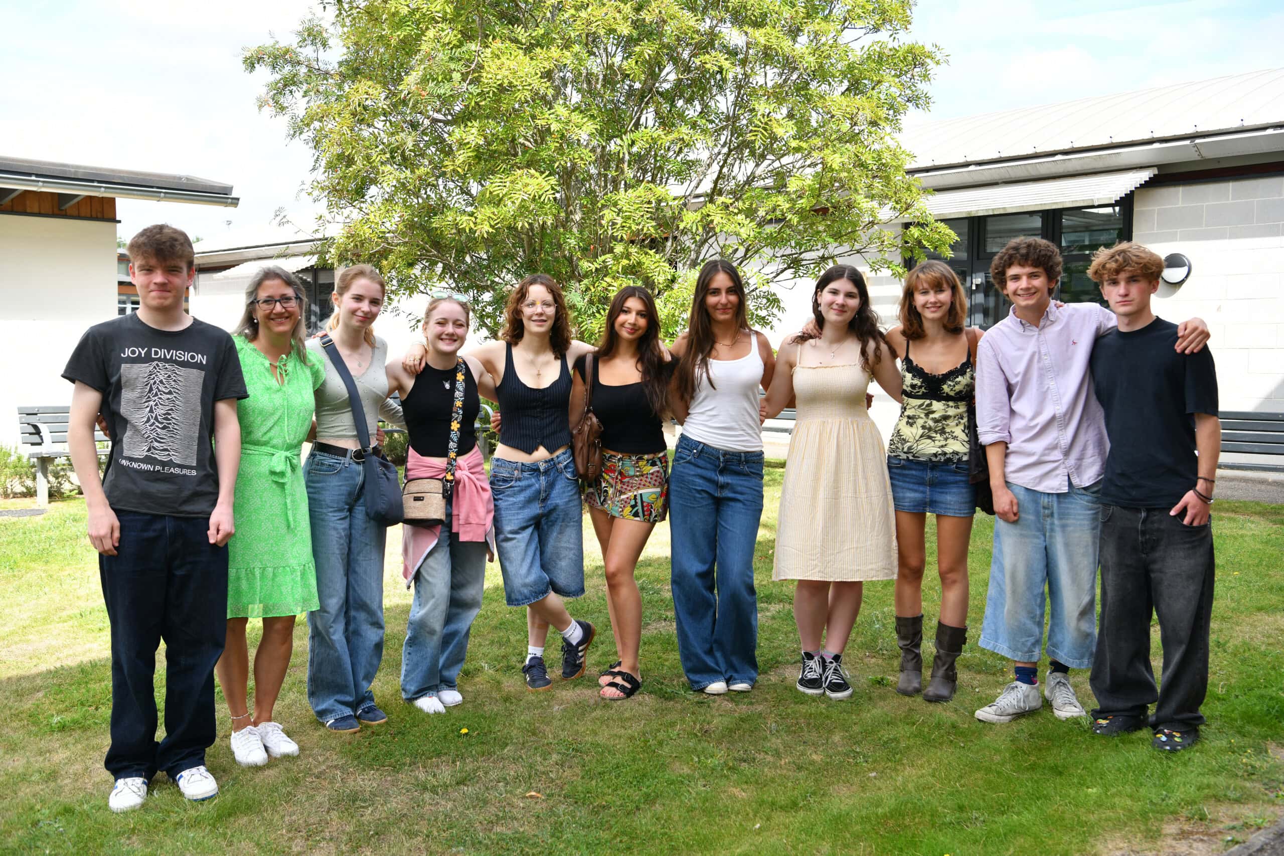 Music BTEC students with head of music stand together celebrating Esher College Results Day 2025 047
