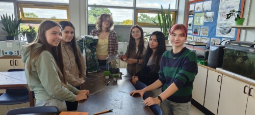 Group of eco committee students standing in a biology lab