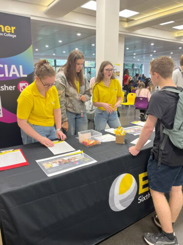 Ambassadors in the cafe talking to a student
