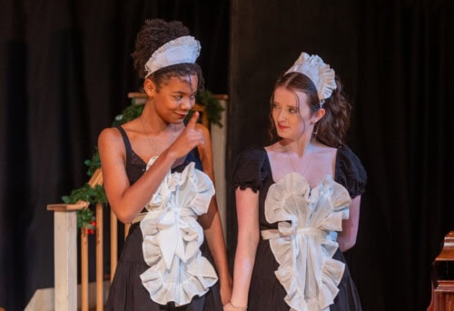 two cast members on stage of cluedo