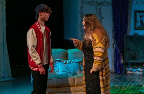 student actors on stage for cluedo