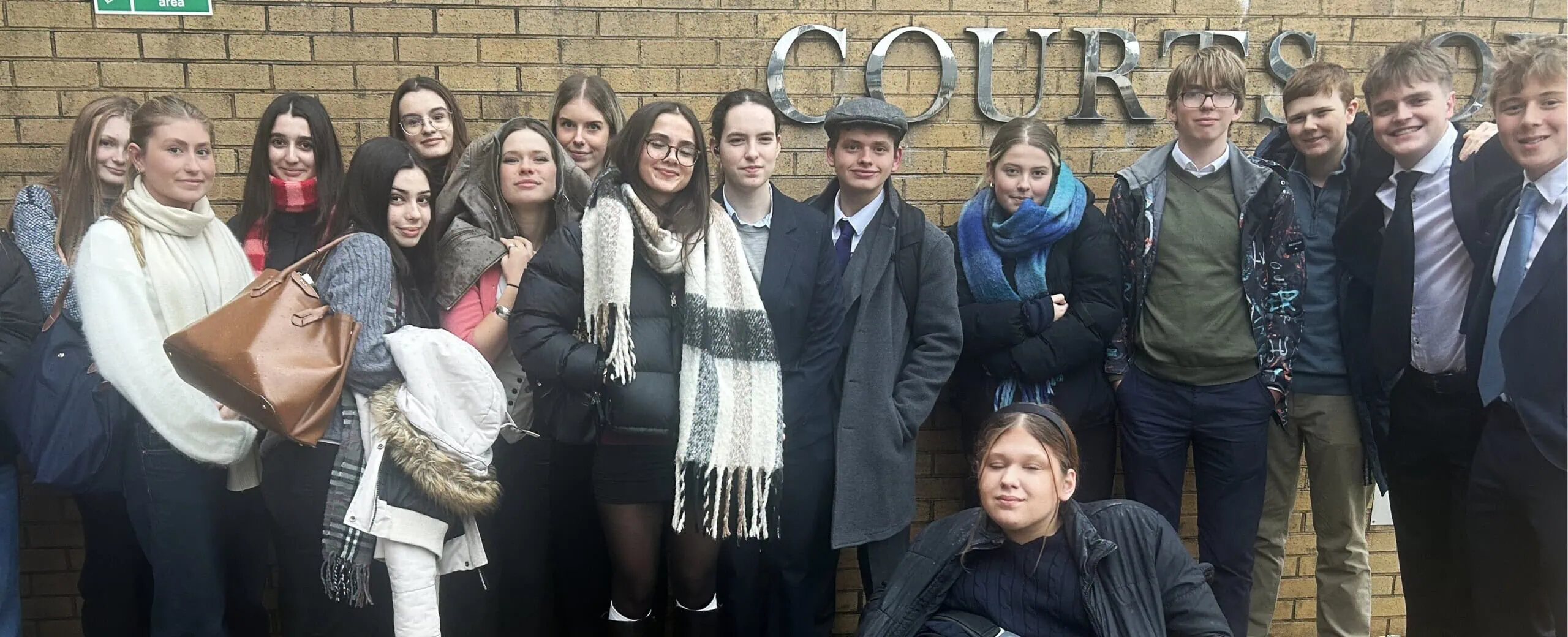 Group Shot Outside Court Scaled E1765365775718