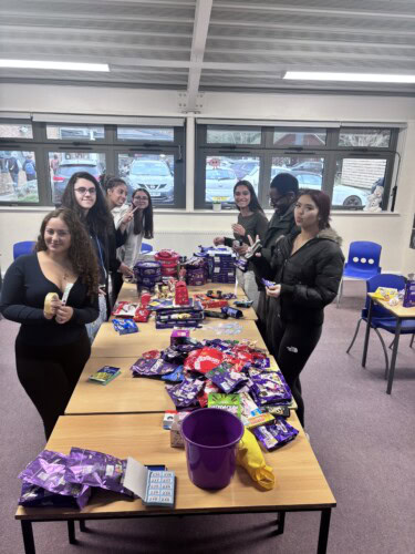 Su members organising the chocolate tombola for christmas